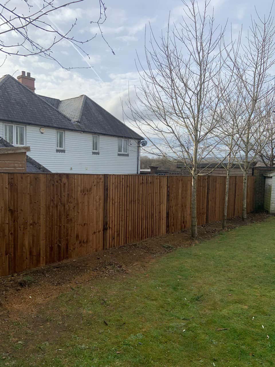 This is a photo of feather edge fencing installed in a residential properties garden by Fast Fix Fencing Chatteris